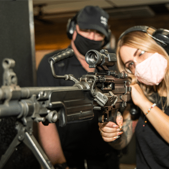 woman shooting the 1919 browning beltfed at the machine guns vegas firearm experience